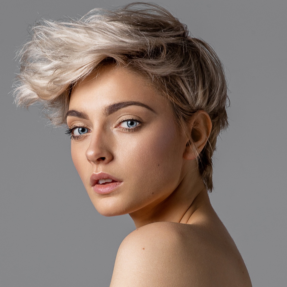 Beauty portrait of fashion young model with short hair