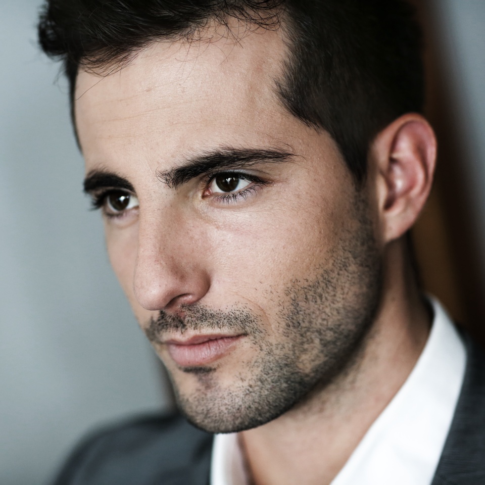 Portrait of handsome man on dark background