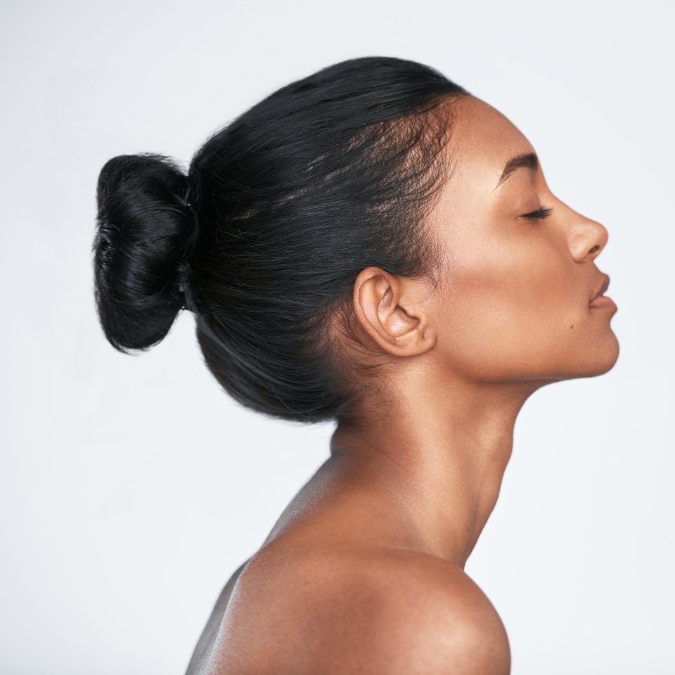 The glow comes from within. Shot of a beautiful young woman posing against a white background.