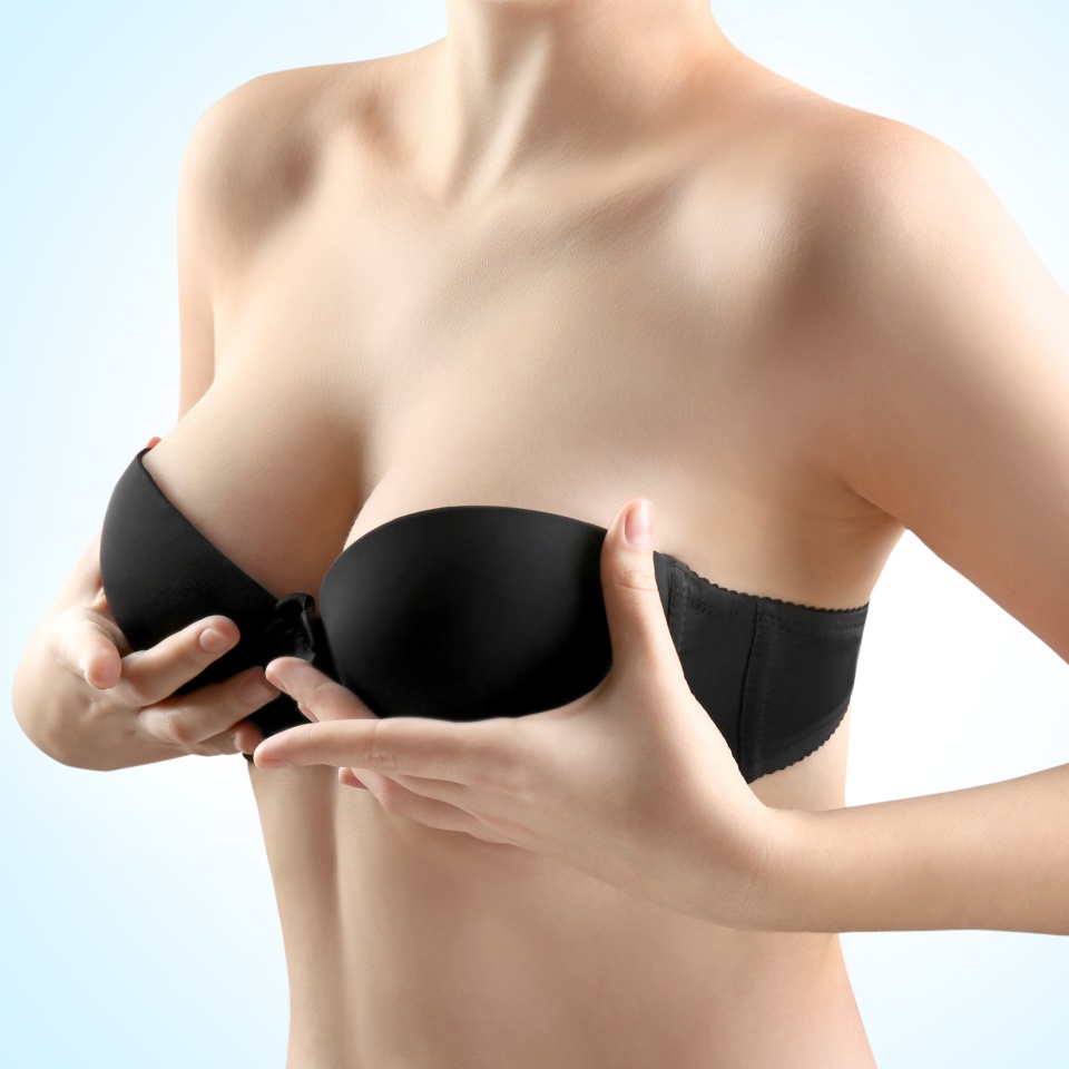 Woman breast, closeup. Plastic correction and surgery concept.